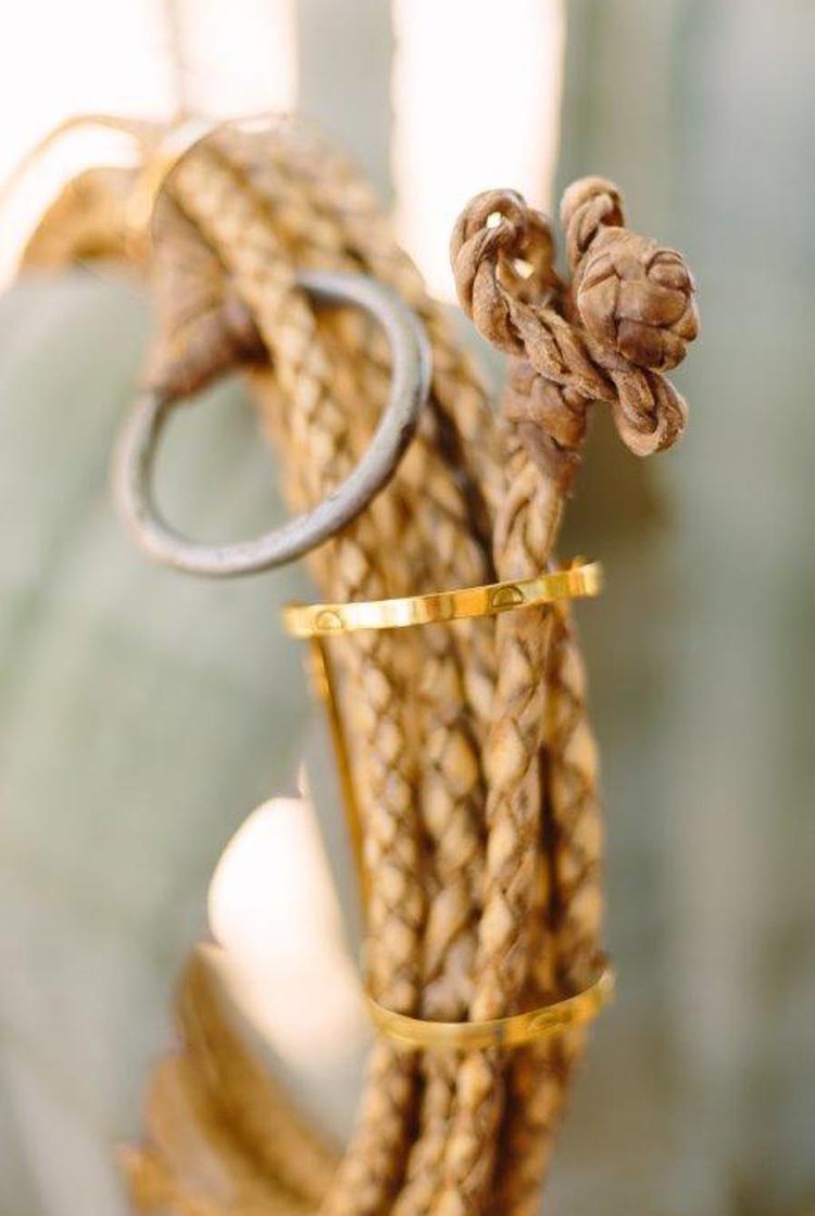 Thin gold rings on rope decor