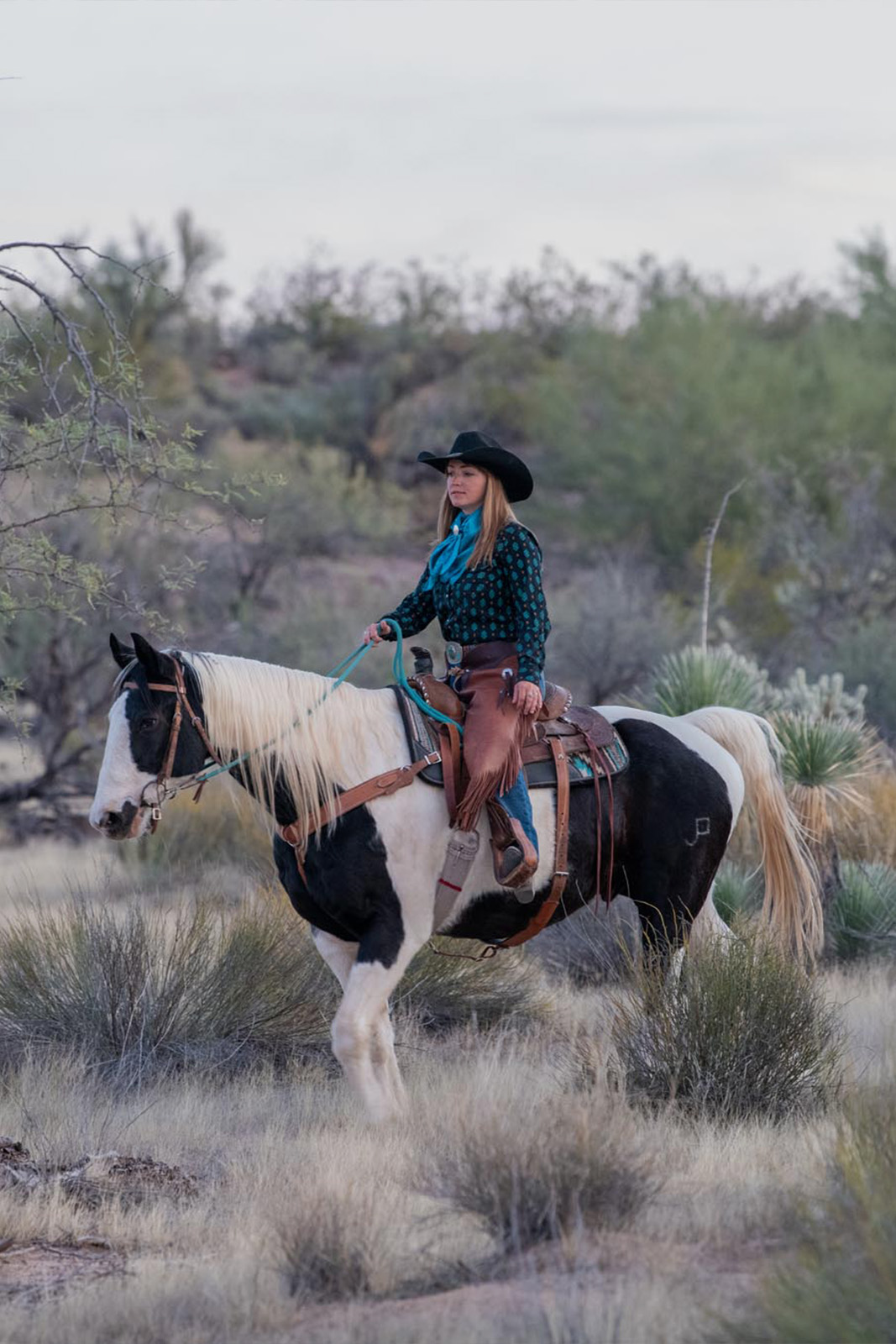 Woman on horse in desert