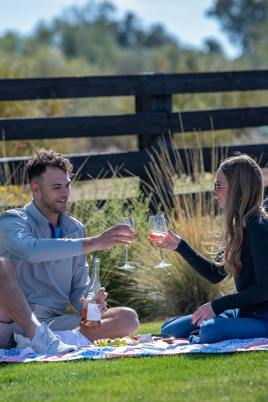 Man and woman drinking wine with cheese
