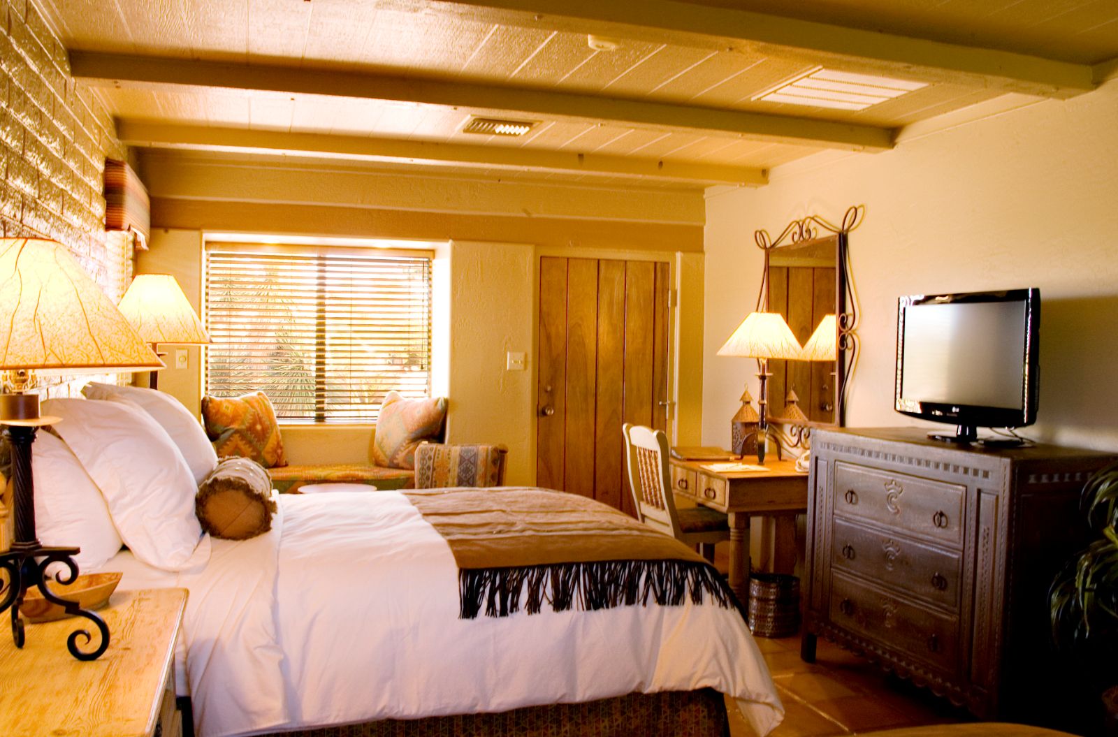 King bed in ranch room with rustic western decor